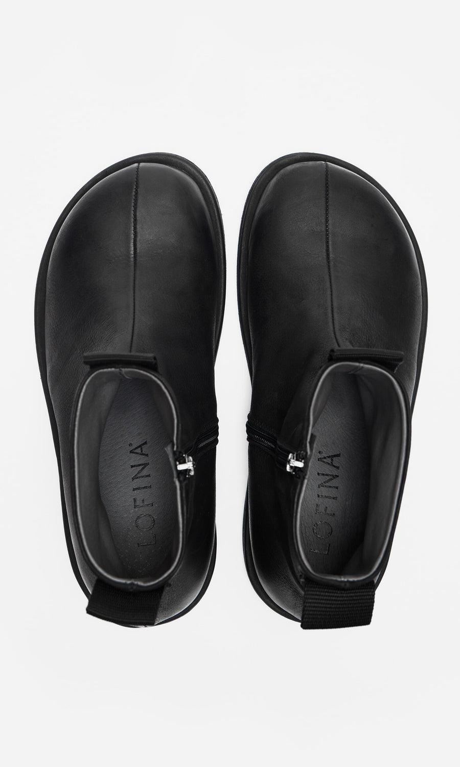 Plümo- Ancona Boots: waxy leather ankle boots with side zippers and pull tabs, shown from above on white.