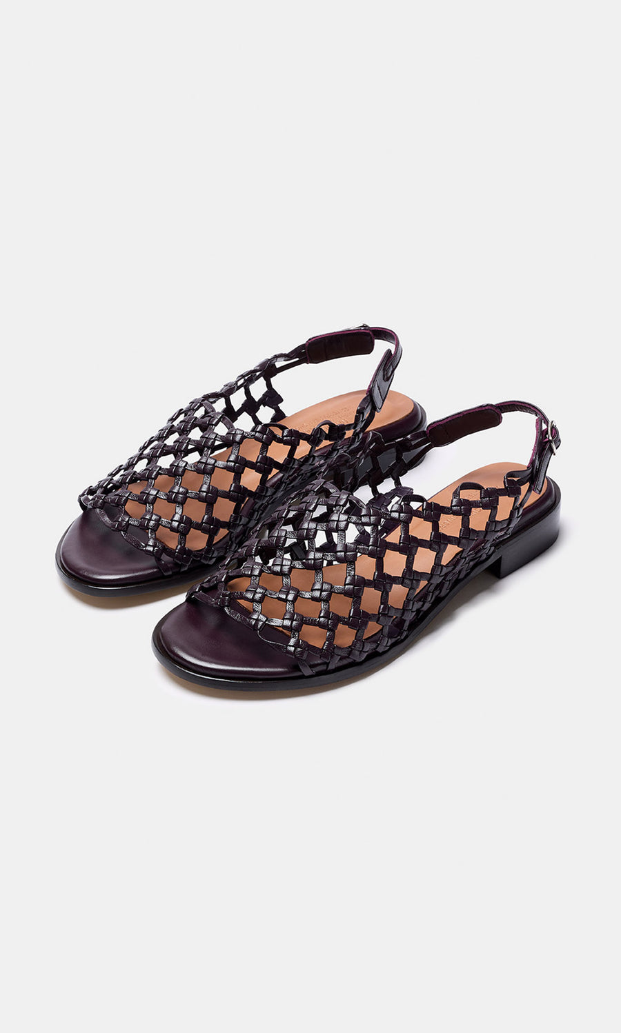Plümo- Arts Club Sandals: Black woven leather sling-back sandals, low heel, handcrafted in Spain, shown on white background.