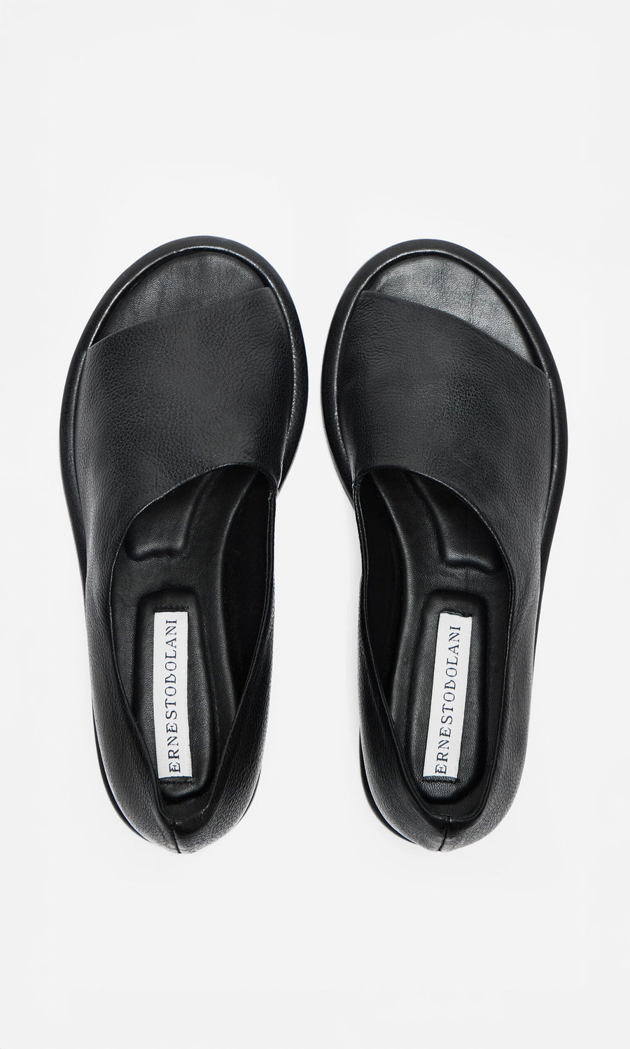 Plümo- A pair of black Hawke Sandals, artisan-made open-toe slip-ons, shown on a white background.